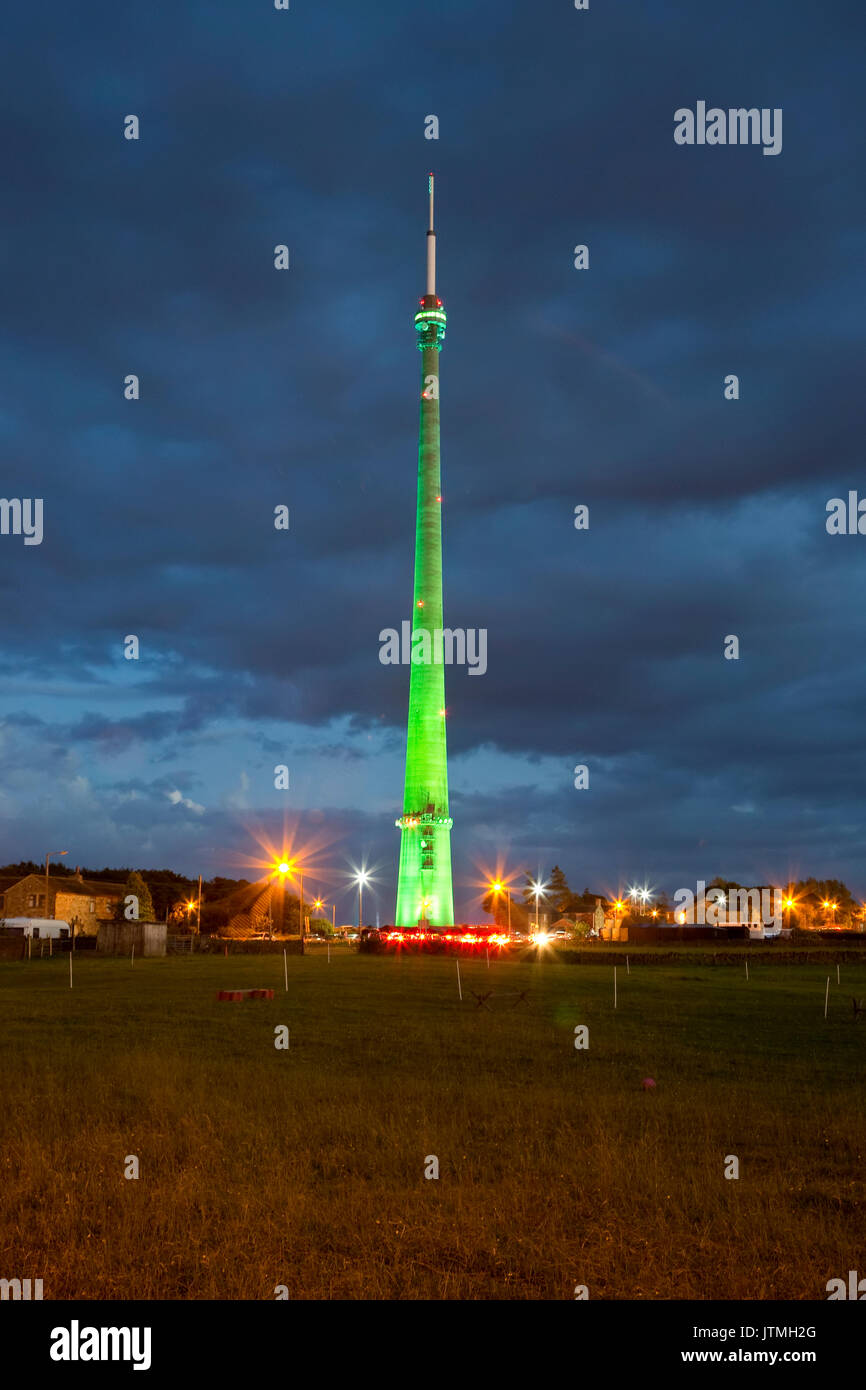 Emley Moor transmission station near Huddersfield at night illuminated in different colours during the start of the Tour de France event Stock Photo