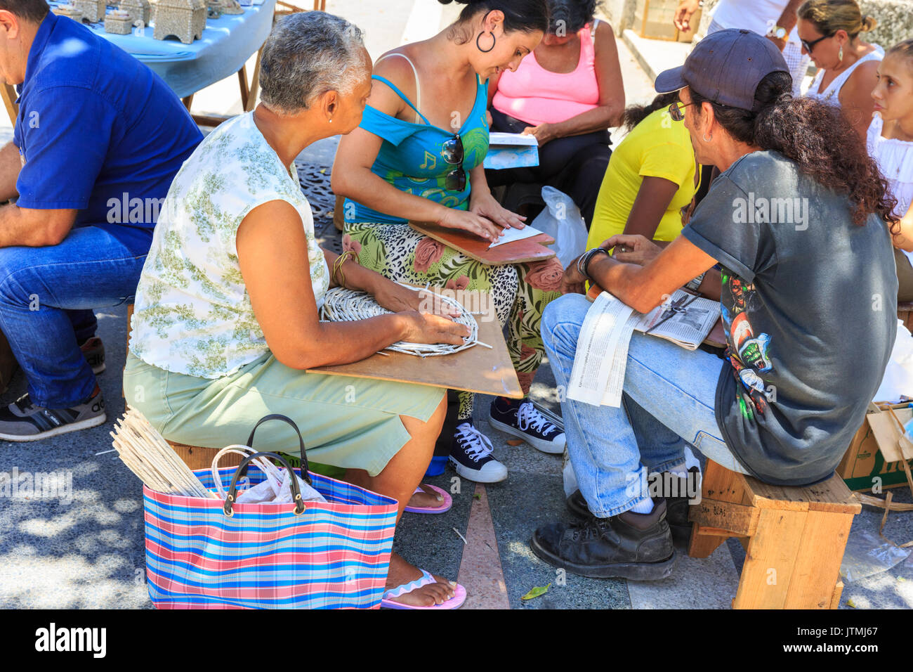 People at a paper craft workshio, Sunday craft market on Pasel del Prado, Havana, Cuba Stock Photo