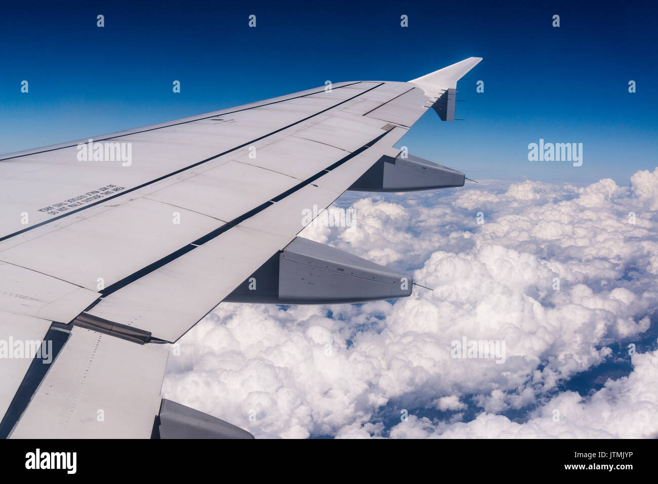 Airplane flying above clouds Stock Photo Alamy