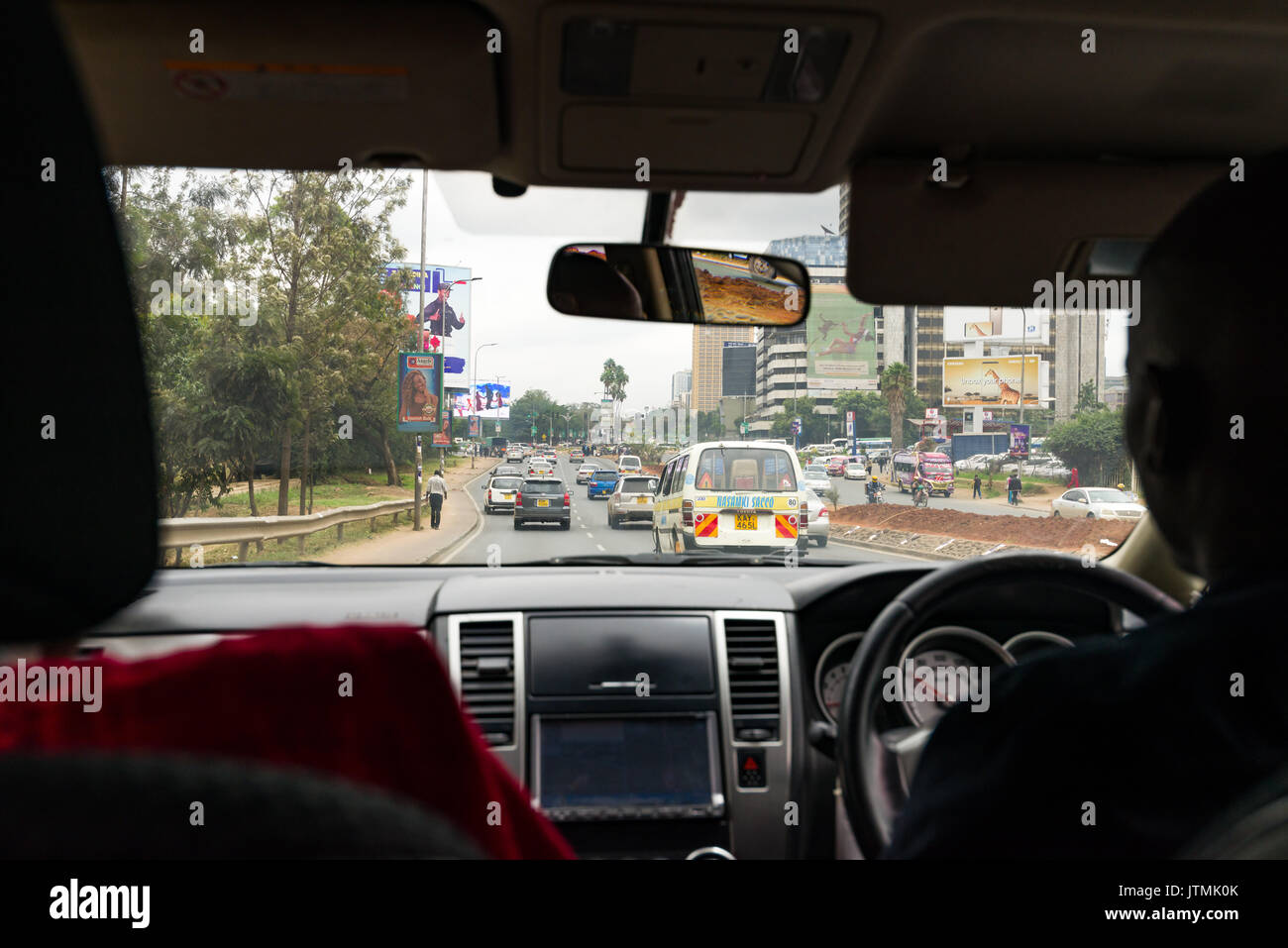 Uhuru highway in Narobi city from Uber taxi vehicle interior showing road and other vehicles, Kenya Stock Photo