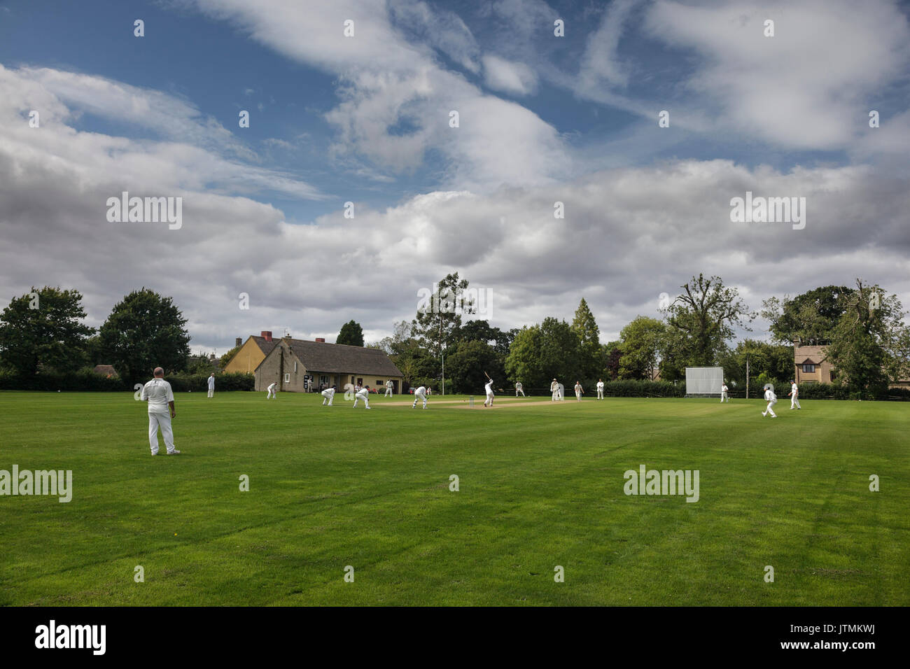 Village cricket match in cotswolds Stock Photo