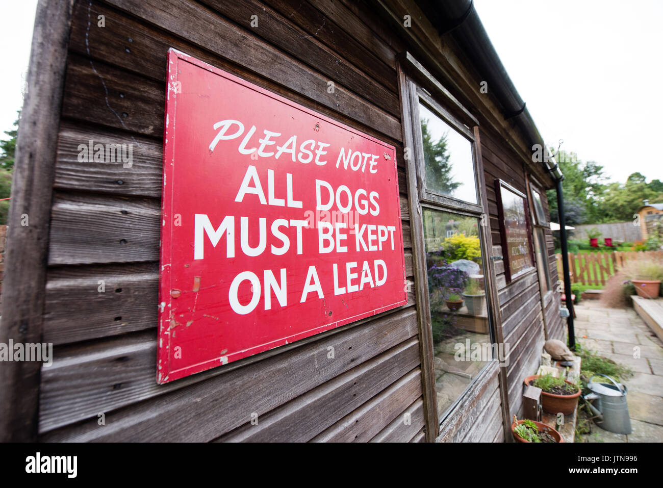 Vintage red handpainted large National Trust sign asking visitors to