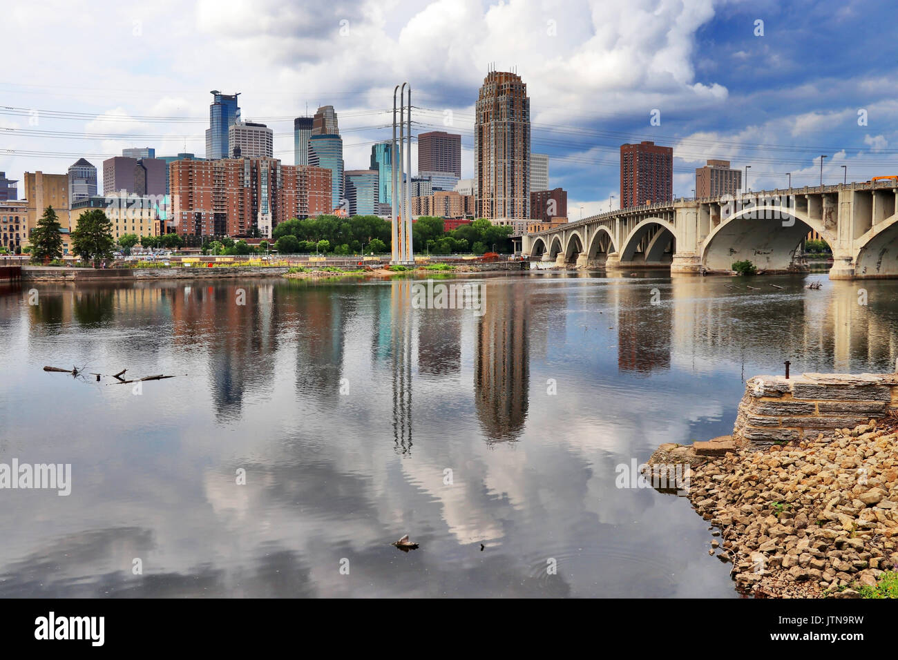 Minneapolis downtown skyline and Third Avenue Bridge above Mississippi river. Midwest USA, Minnesota state. Stock Photo