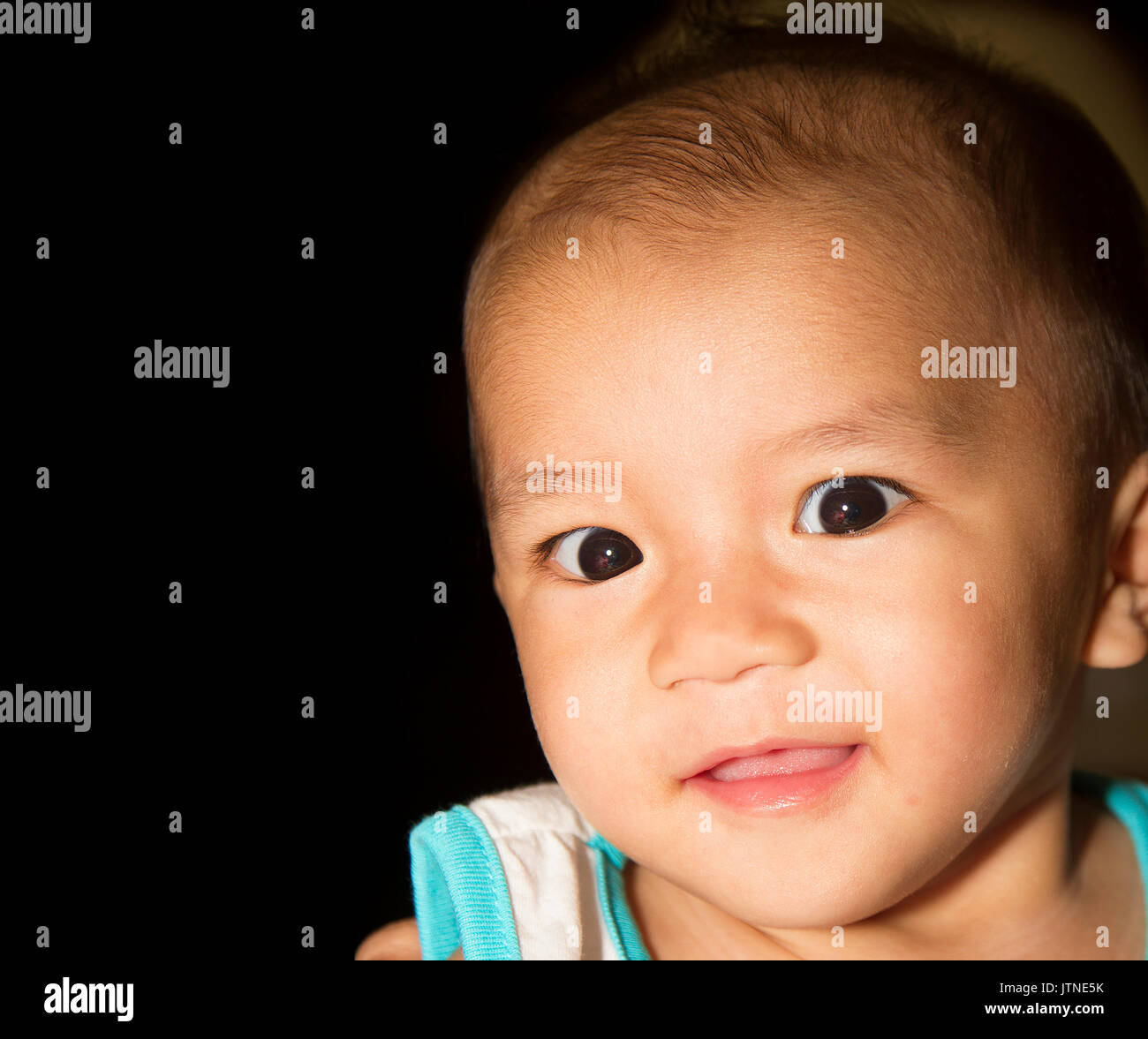 A baby boy portaiture with black color copy space. Stock Photo