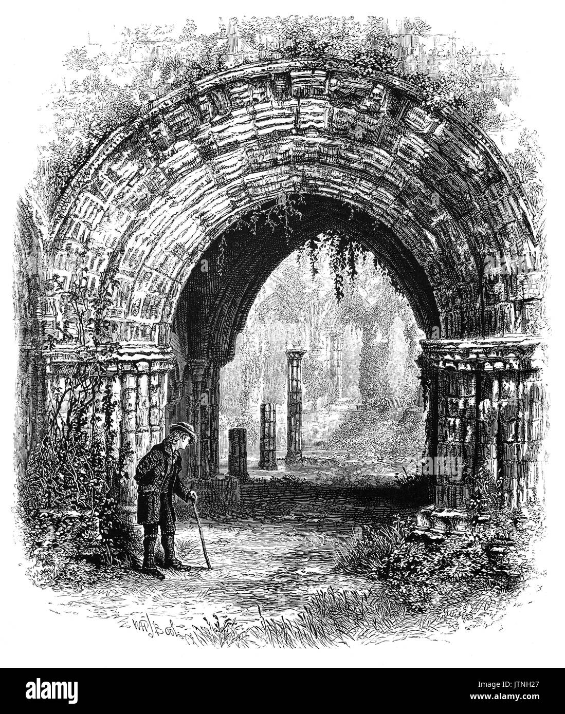 1870: Old man beside a beautiful Romanesque arch in Furness Abbey, or St. Mary of Furness is a former Cistercian monastery located in the northern outskirts of Barrow-in-Furness, Cumbria, England. The abbey dates back to 1123. Stock Photo