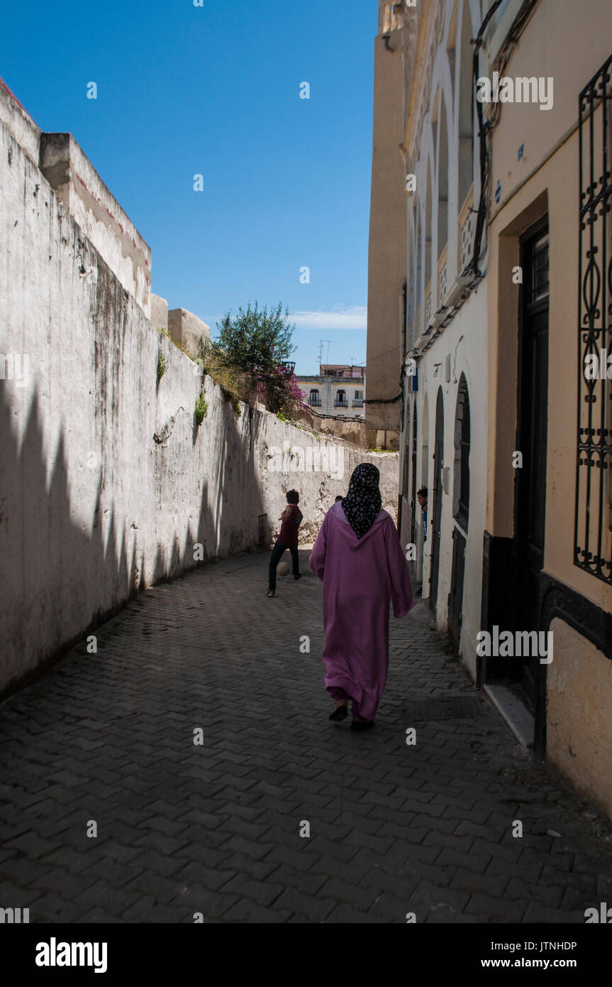 Morocco: people in the narrow alleys of Tangier, city on the Maghreb coast guarding the Strait of Gibraltar with its unique blend of cultures Stock Photo