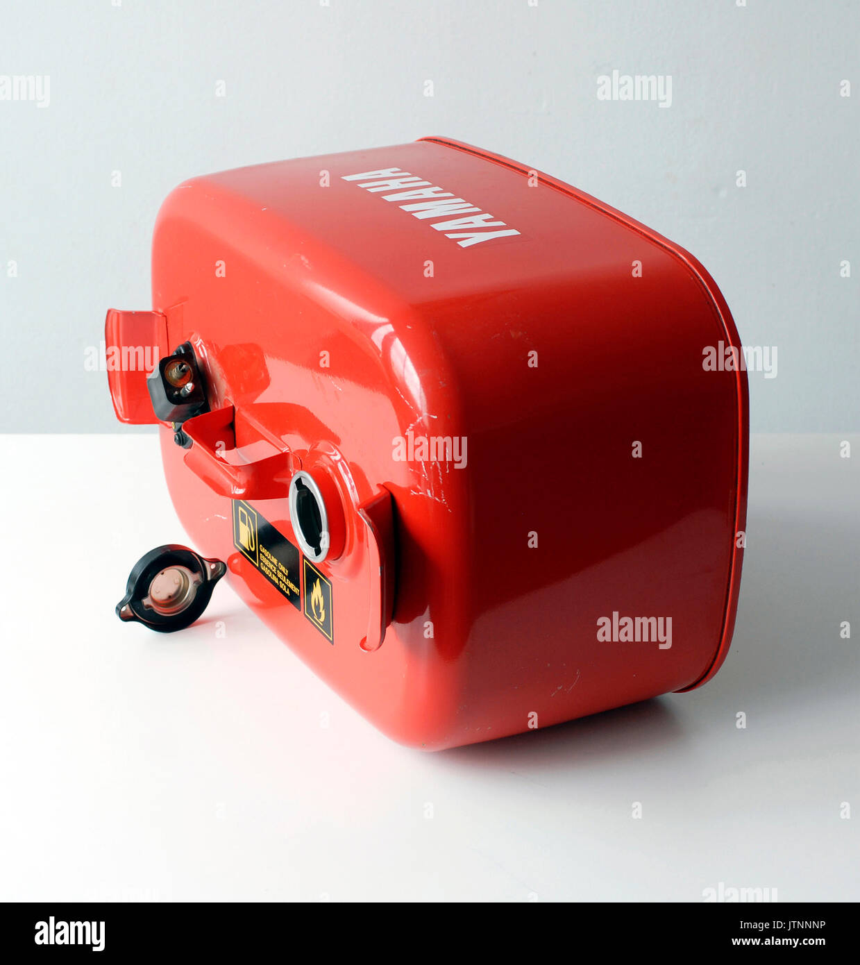 Vintage metal drum for gasoline, made by metal painted red Stock Photo