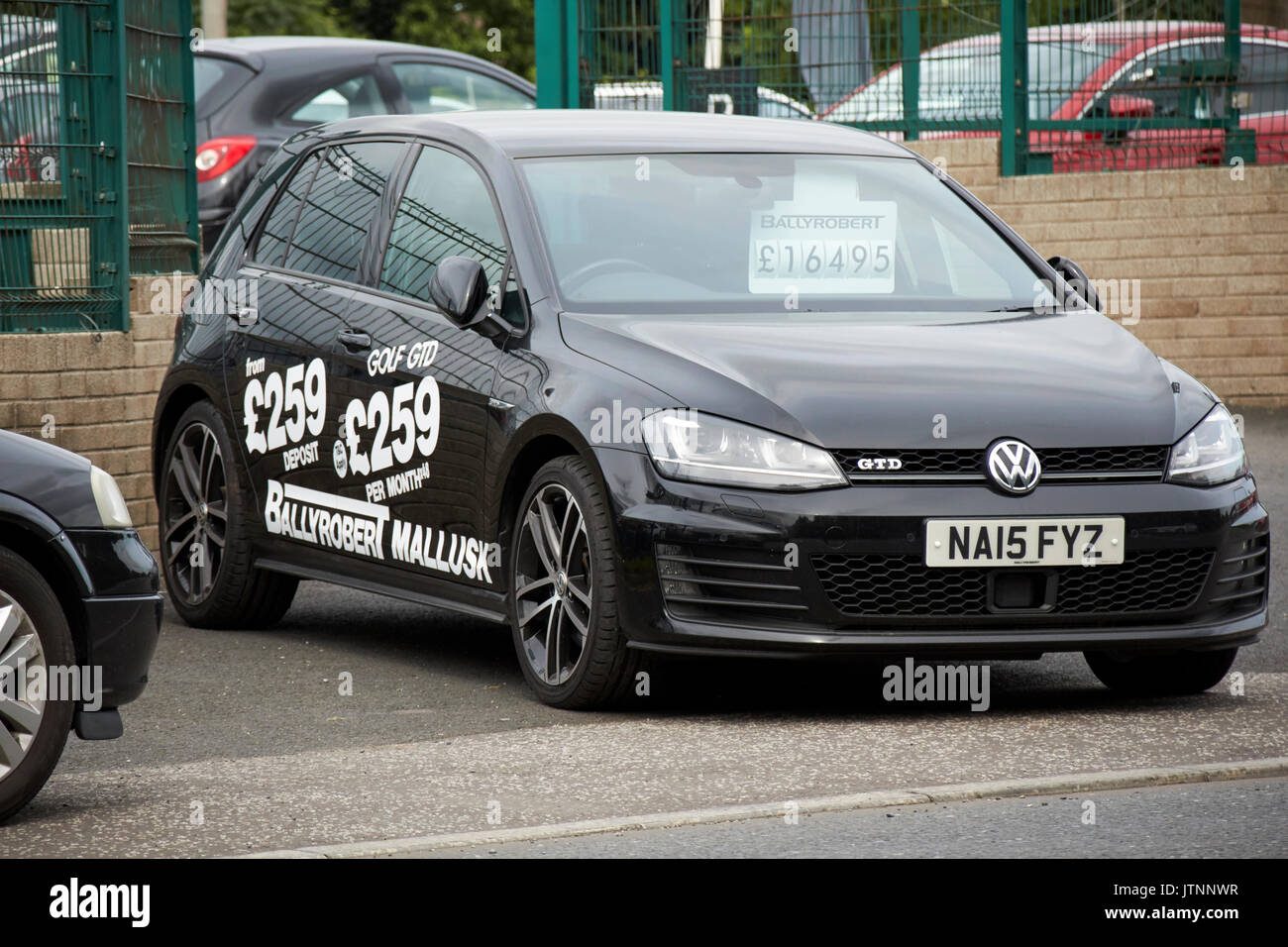 used golf car with advert for pcp hire prices on the side Stock Photo