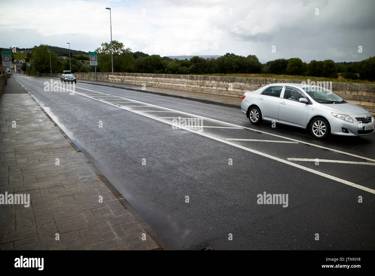 cars crossing land border between northern ireland and the republic of ireland in belcoo - blacklion Stock Photo