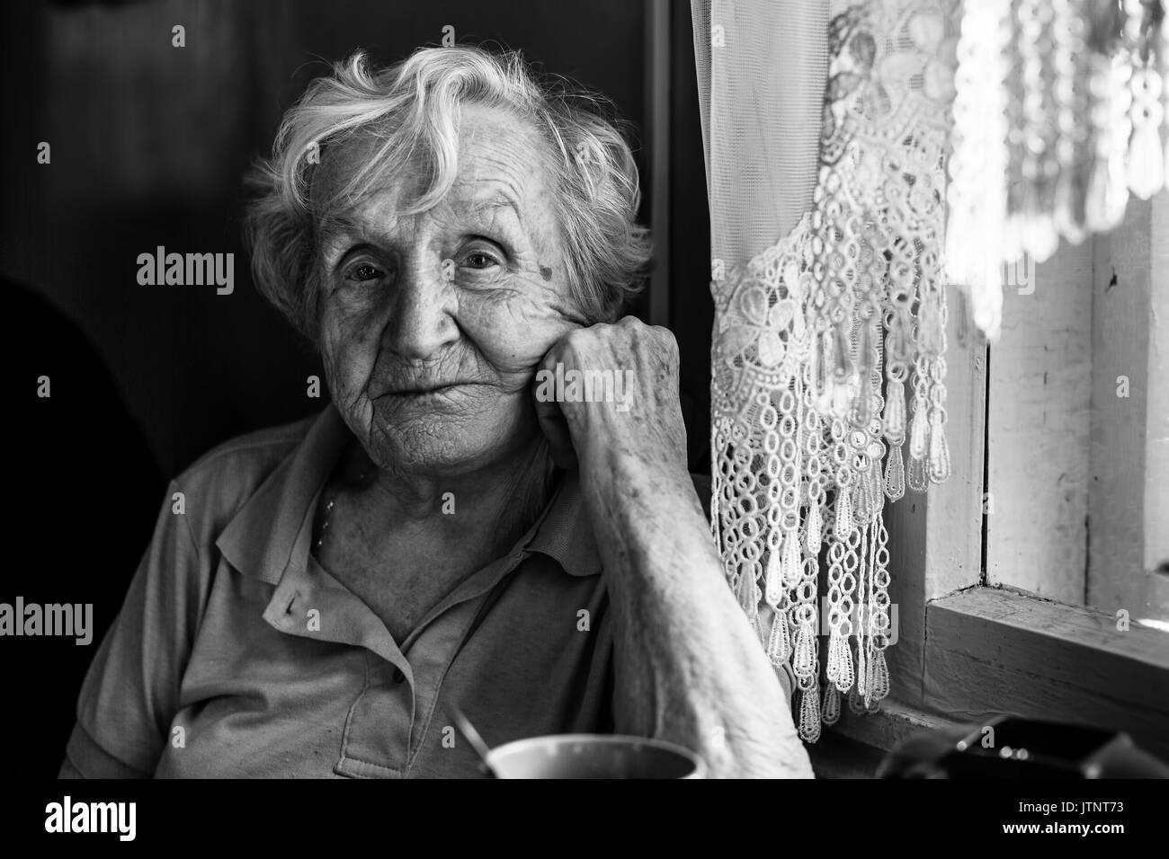 Photo by Linda M, - Black and white portrait of an elderly woman with gray  hair