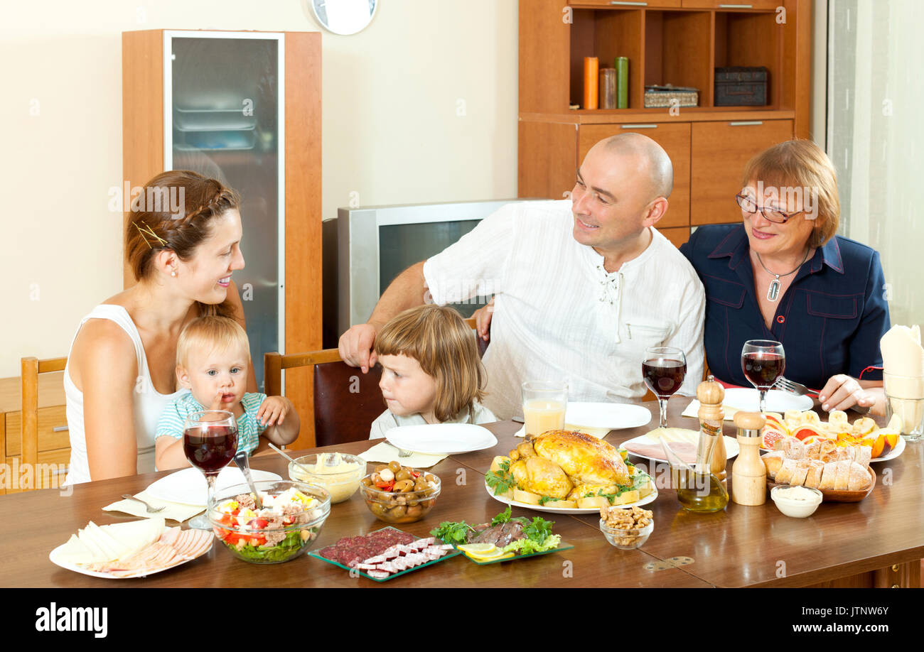 Happy multigeneration family having holiday dinner at home together