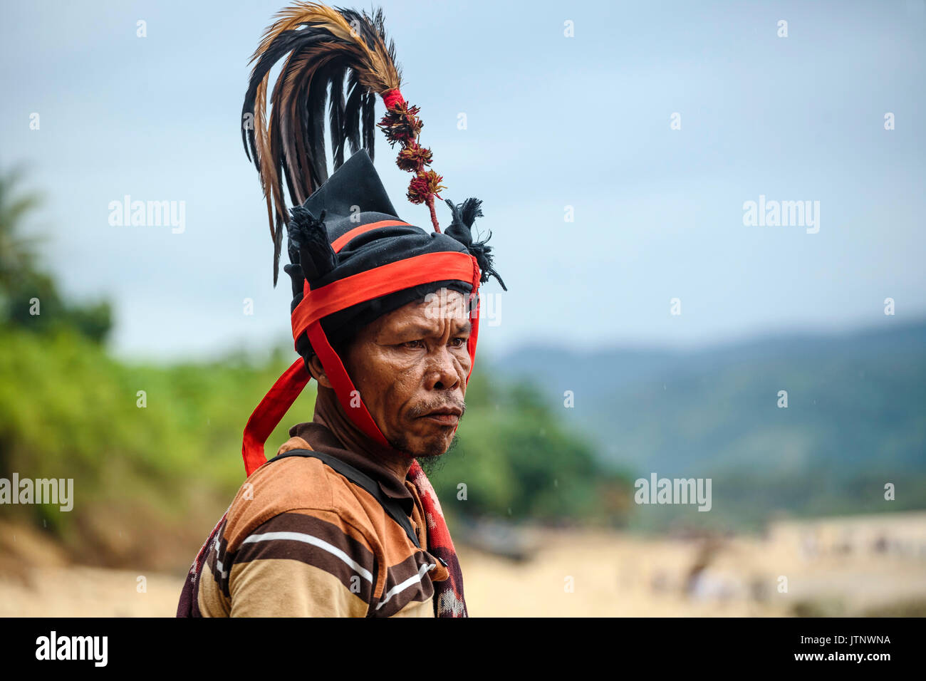 Man wearing hat and traditional costume, Pasola festival, Sumba Island, Indonesia Stock Photo