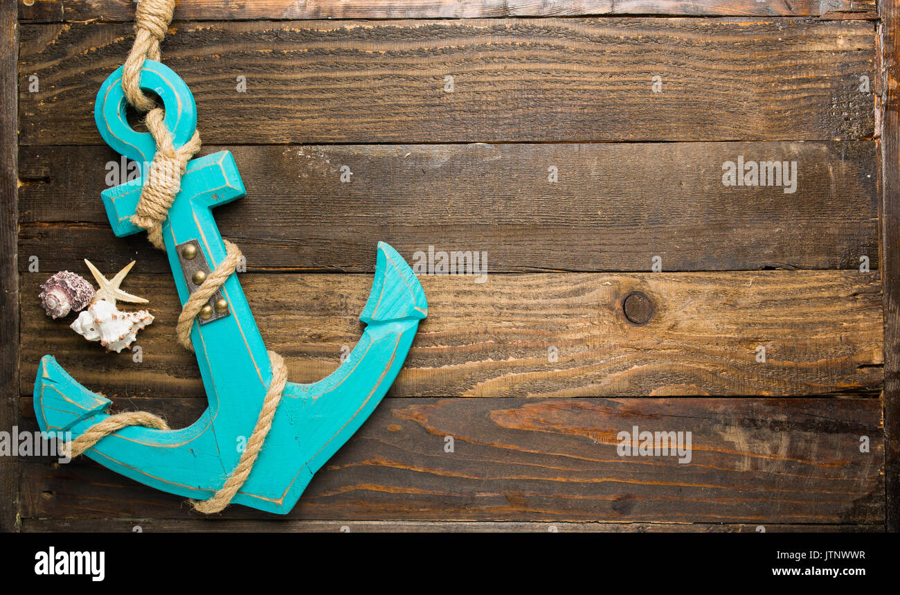 Marine coastal themed background with anchor and sea shells Stock Photo
