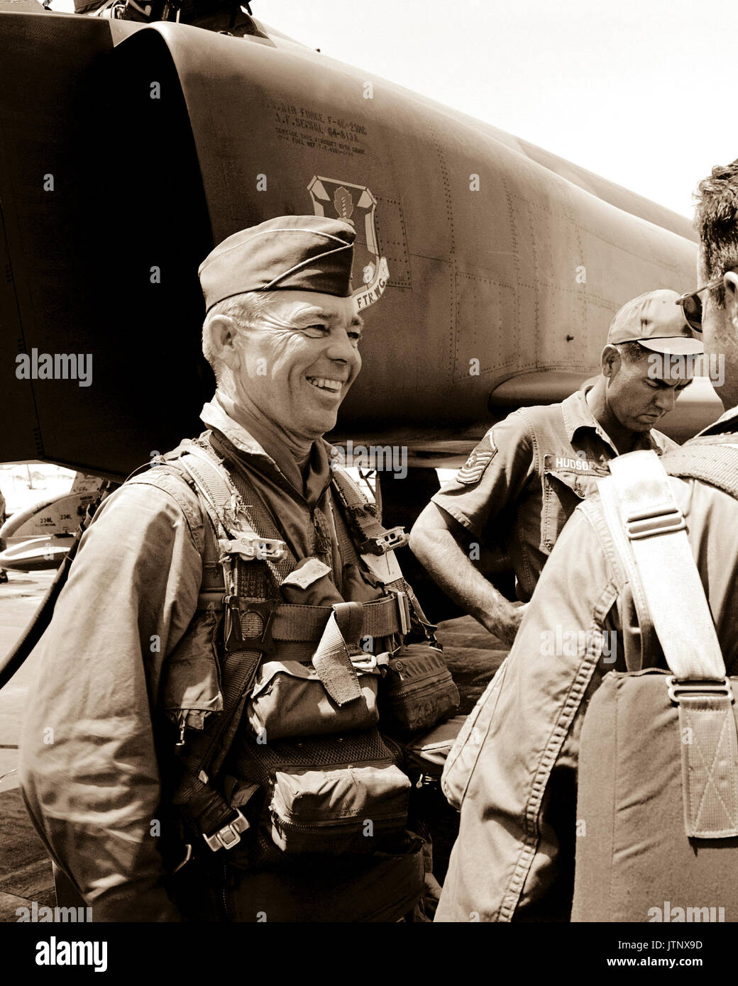 COL W.E. Davis Jr., commander, 12th Tactical Fighter Wing, talks with other pilots after completing his 200th and last combat mission over North and South Vietnam.  The mission consisted of attacking a Viet Cong concentration area, destroying military fortifications and inflicting heavy damage. Stock Photo