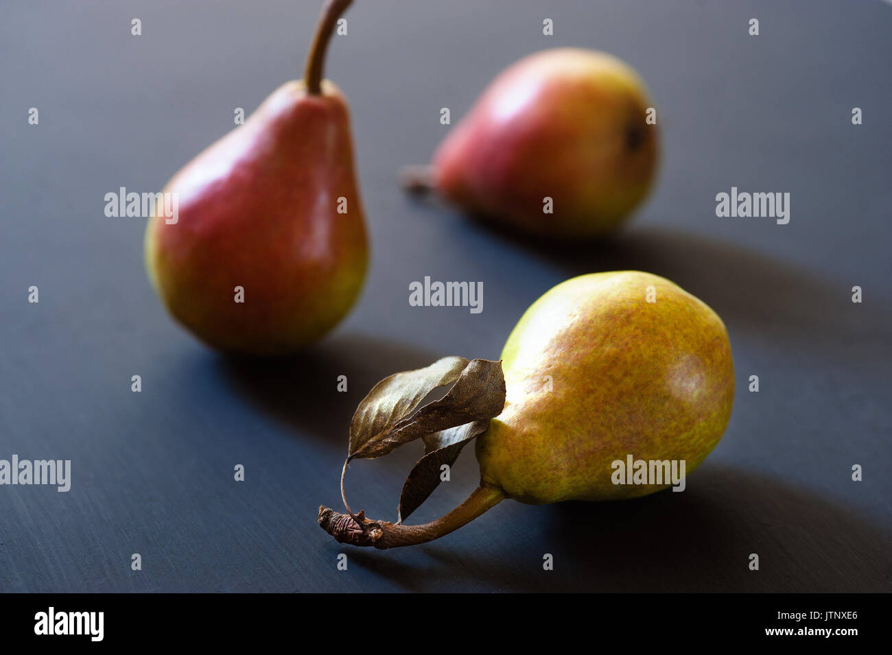 Three ripe juicy pears on a background Stock Photo