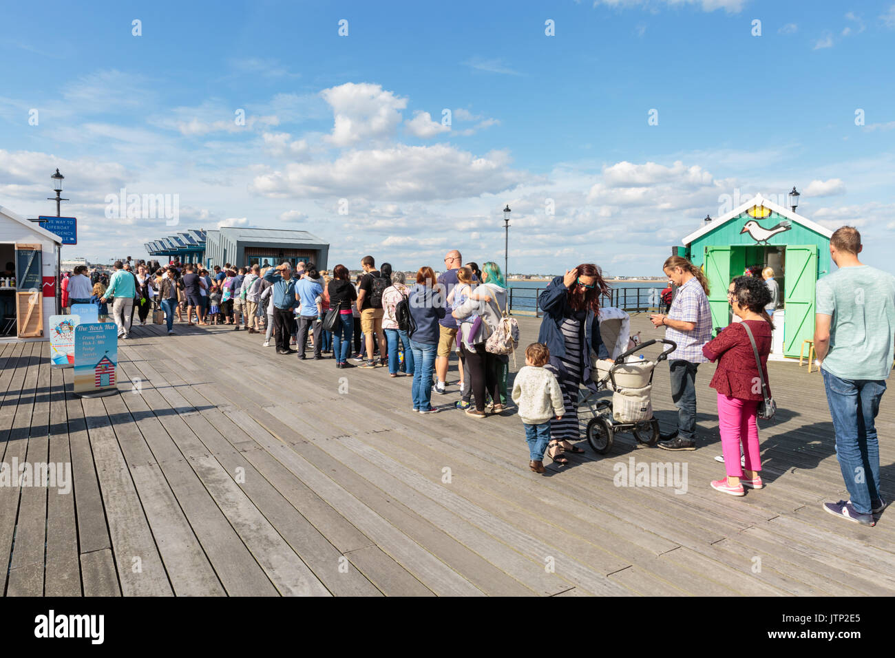 Long queue of people waiting for the Southend Pier Railway, Southend-on-Sea, Essex, UK Stock Photo