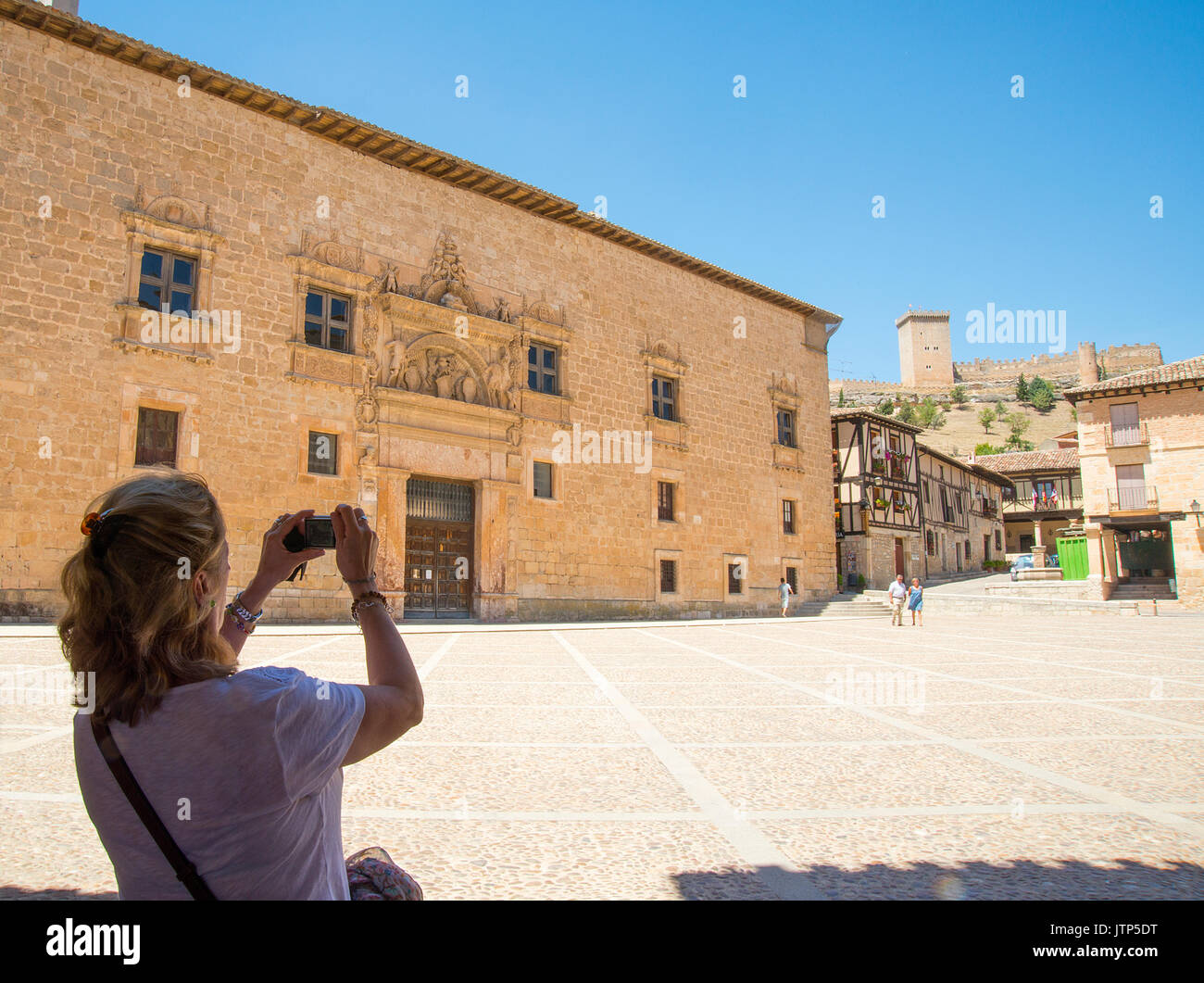 Tourist taking photos at the Main Square. Peñaranda de Duero, Burgos province, Castilla Leon, Spain. Stock Photo