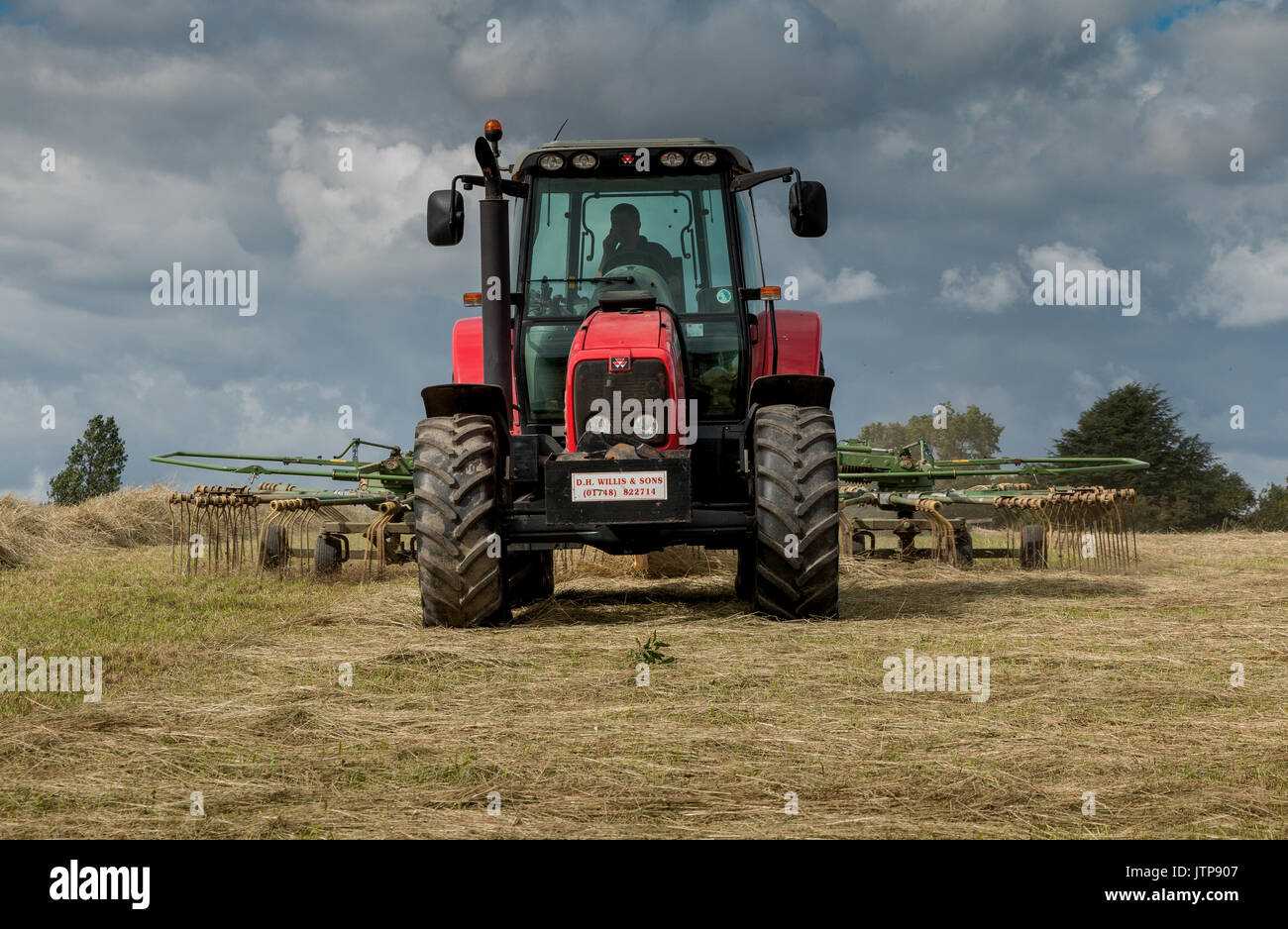 UK Farming - Tractor and Hay Rake at Work August 2017 with copy space ...