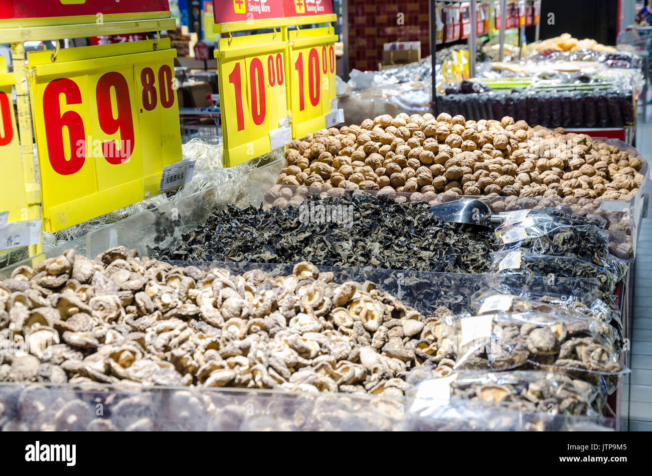 Dried mushrooms and walnuts on sale in a supermarket in shanghai, China. Stock Photo