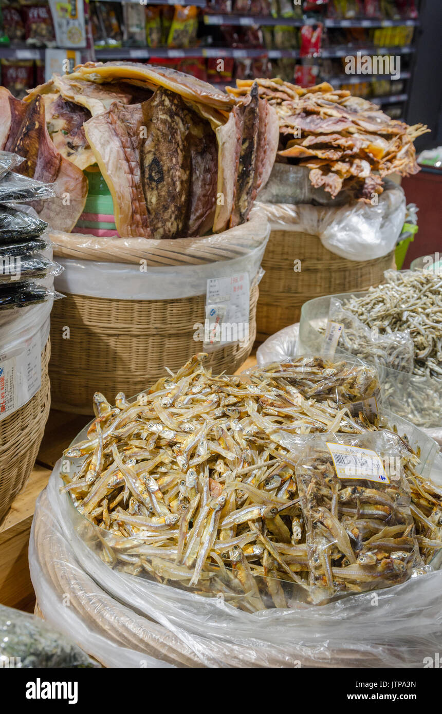 Dried fish an dried squid for sale in a supermarket Stock Photo Alamy