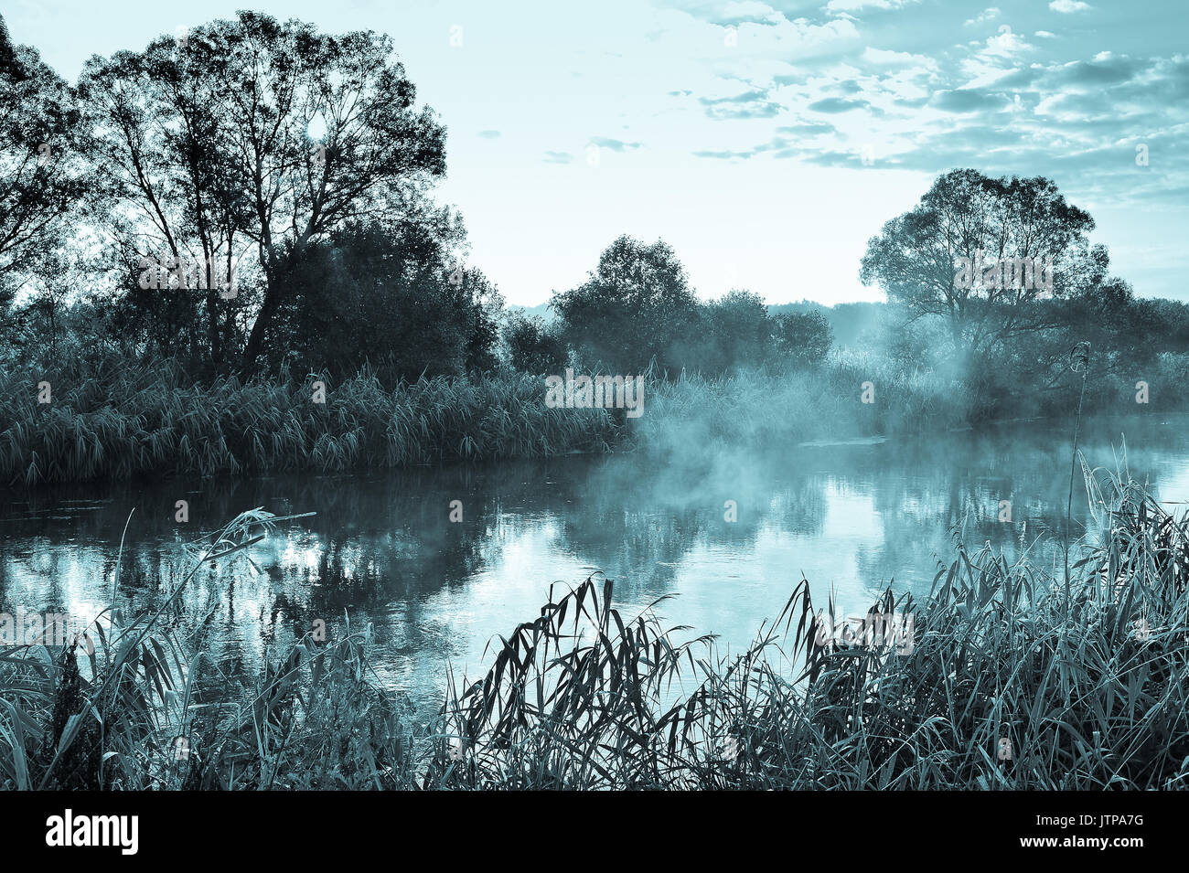 Photo with a sunny summer sunrise over the river Stock Photo - Alamy