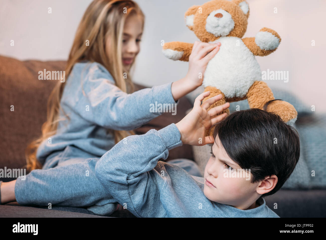 Sad boy with teddy bear hi-res stock photography and images - Alamy