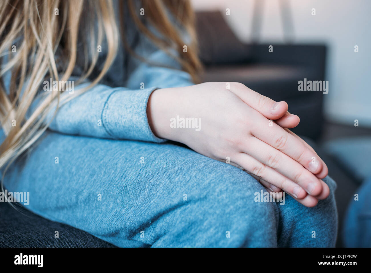 Girl with folded hands hi-res stock photography and images - Alamy