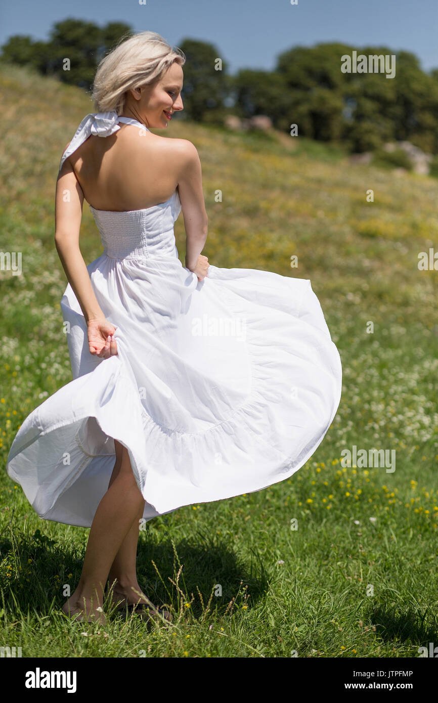 Long white dress hi-res stock photography and images - Alamy