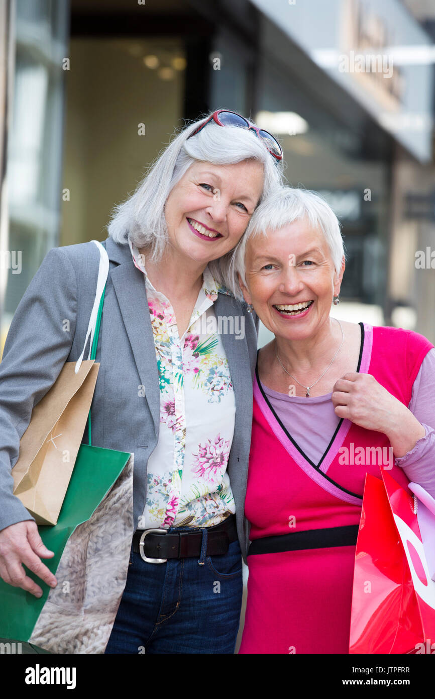 Two older women on a shopping tour Stock Photo Alamy