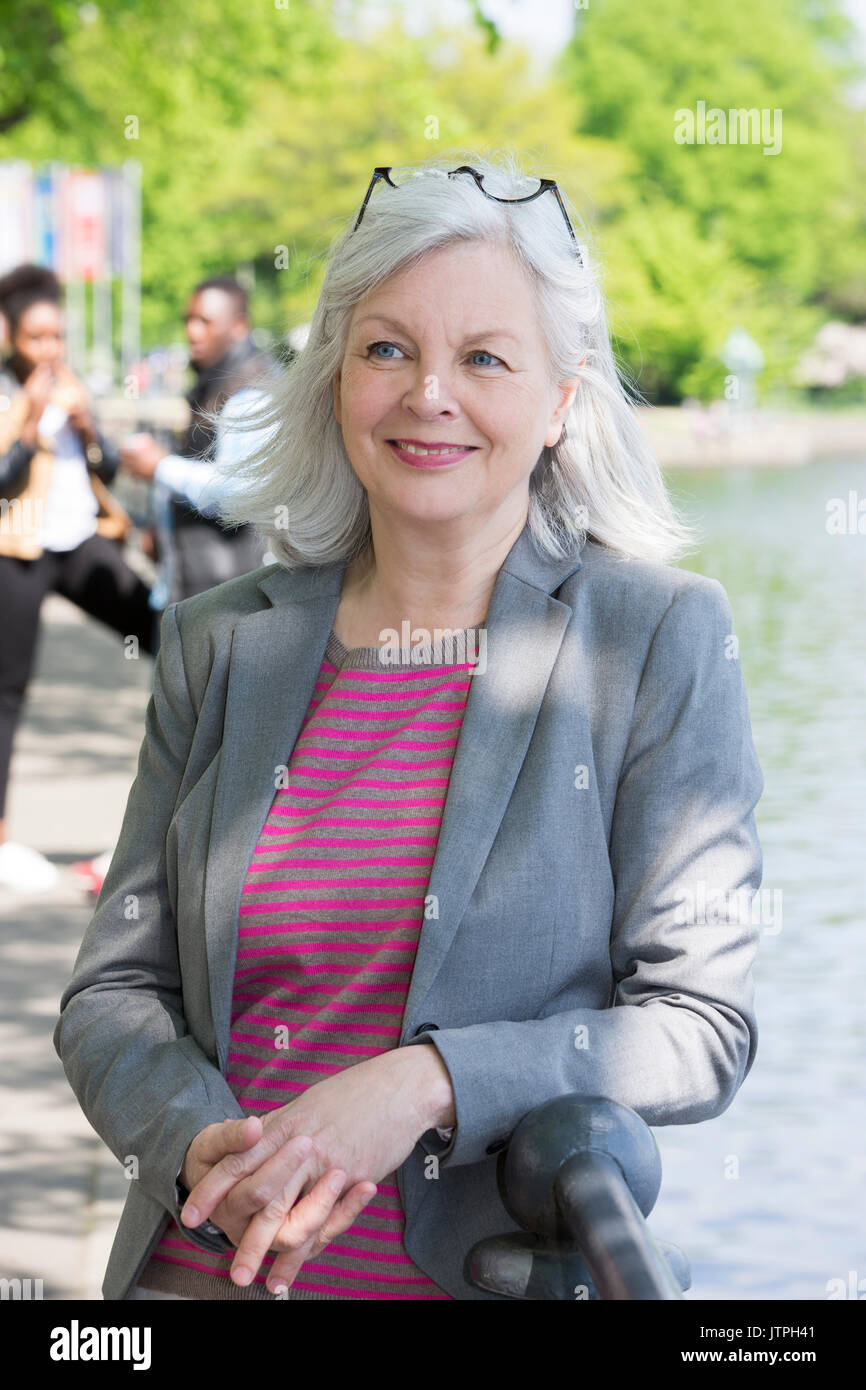 Mature Woman With Long Gray Hair Standing Stock Photo 