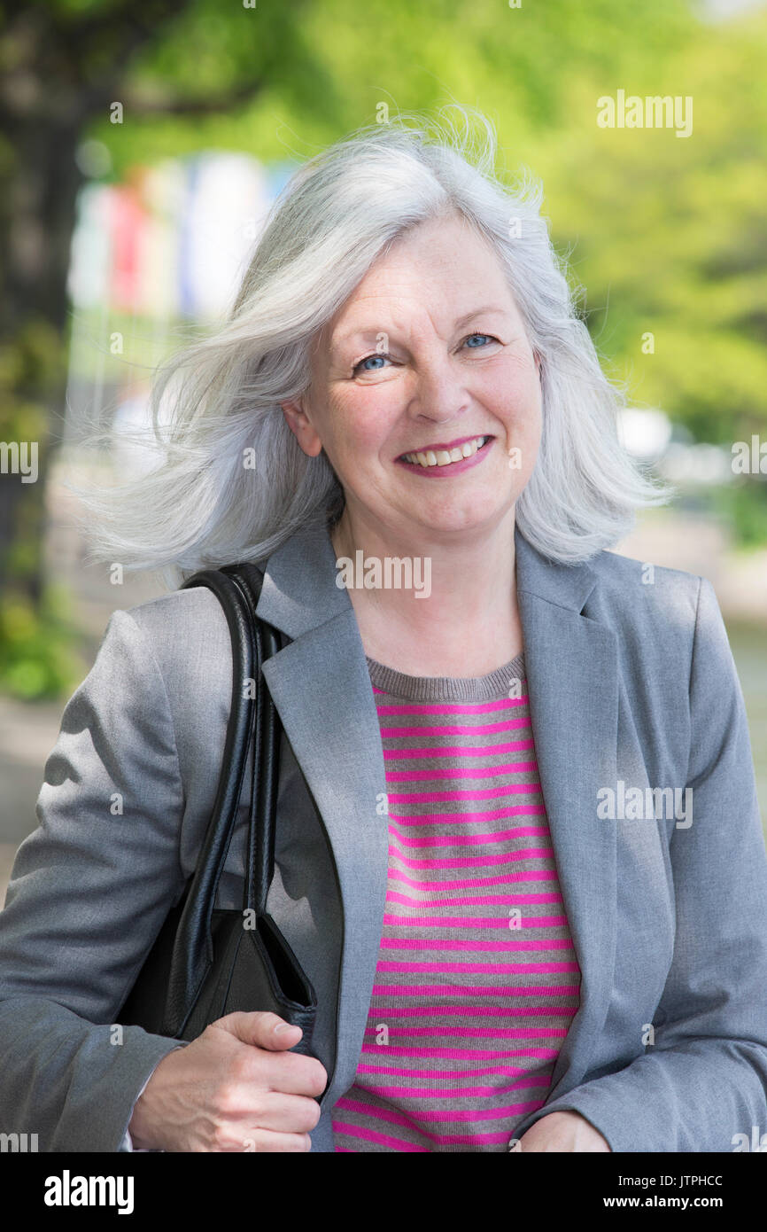 Portrait Of An Older Woman With Grey Hair Stock Photo