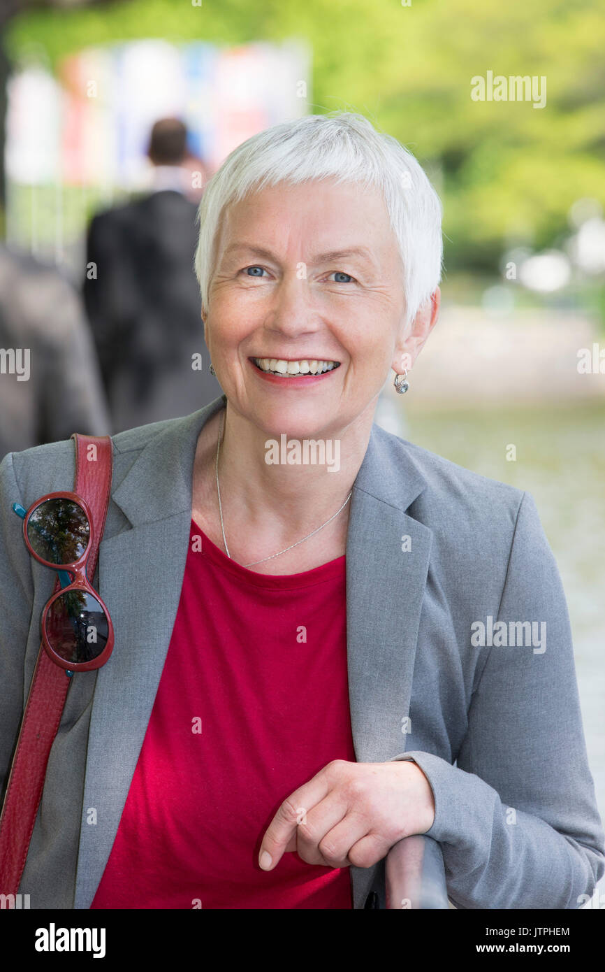 Portrait Of An Older Woman With Short Grey Hair Stock Photo