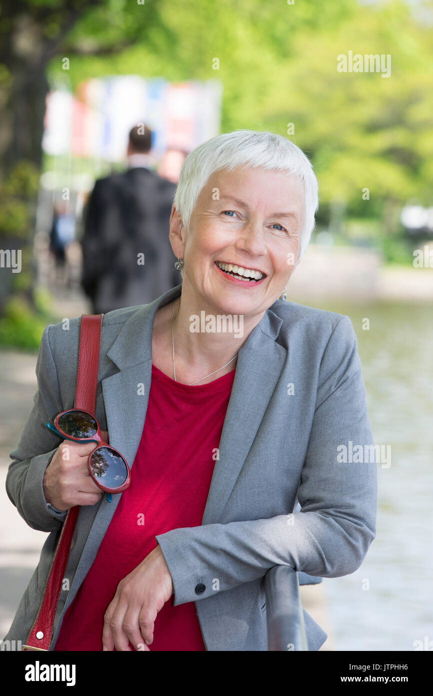 Portrait Of An Older Woman With Short Grey Hair Stock Photo