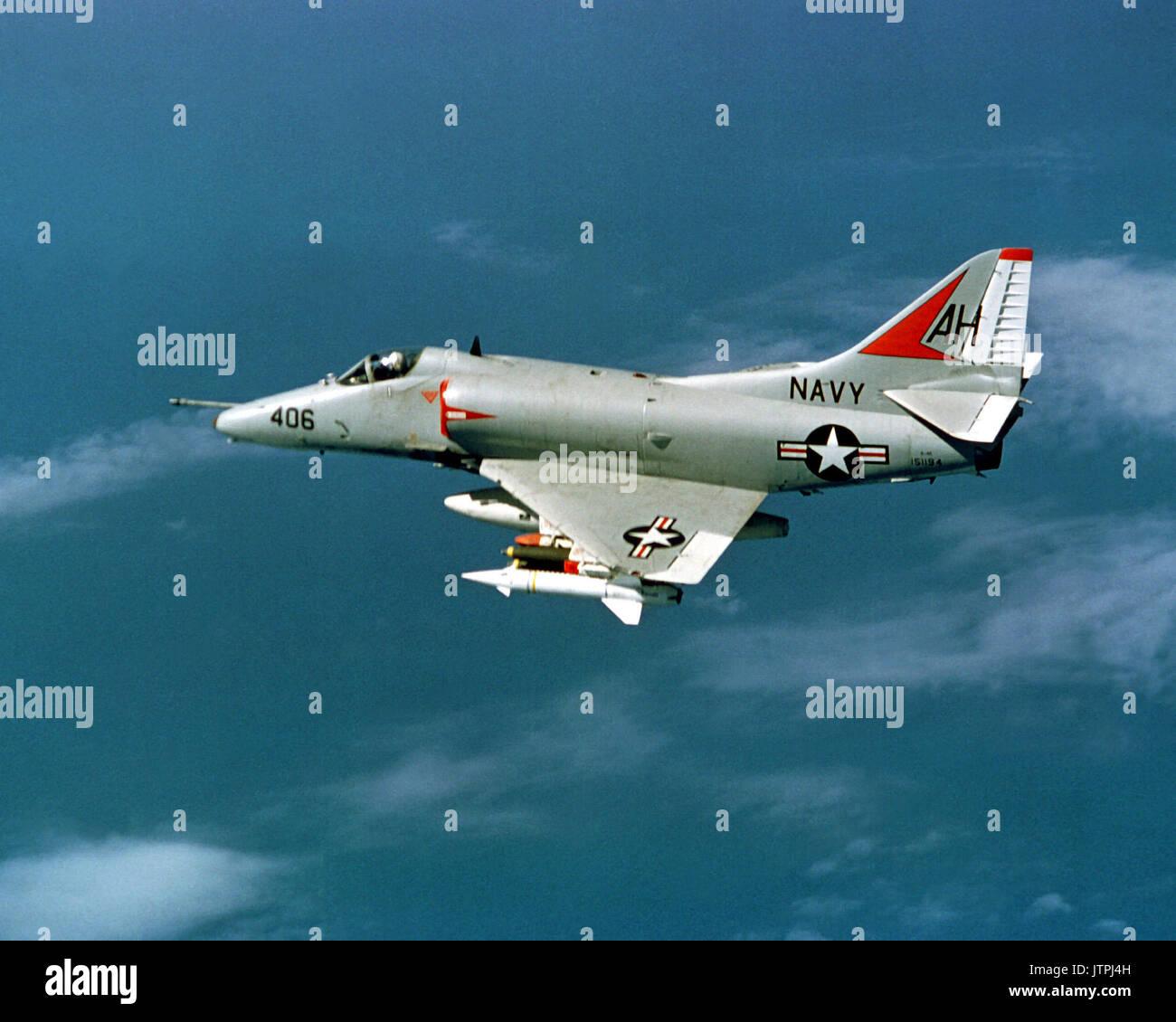 An air-to-air left side view of an Attack Squadron 164 (VA-164) A-4 Skyhawk aircraft en route to a target in North Vietnam.  The aircraft is piloted by Cmdr. William F. Span, executive officer of VA-164. Stock Photo