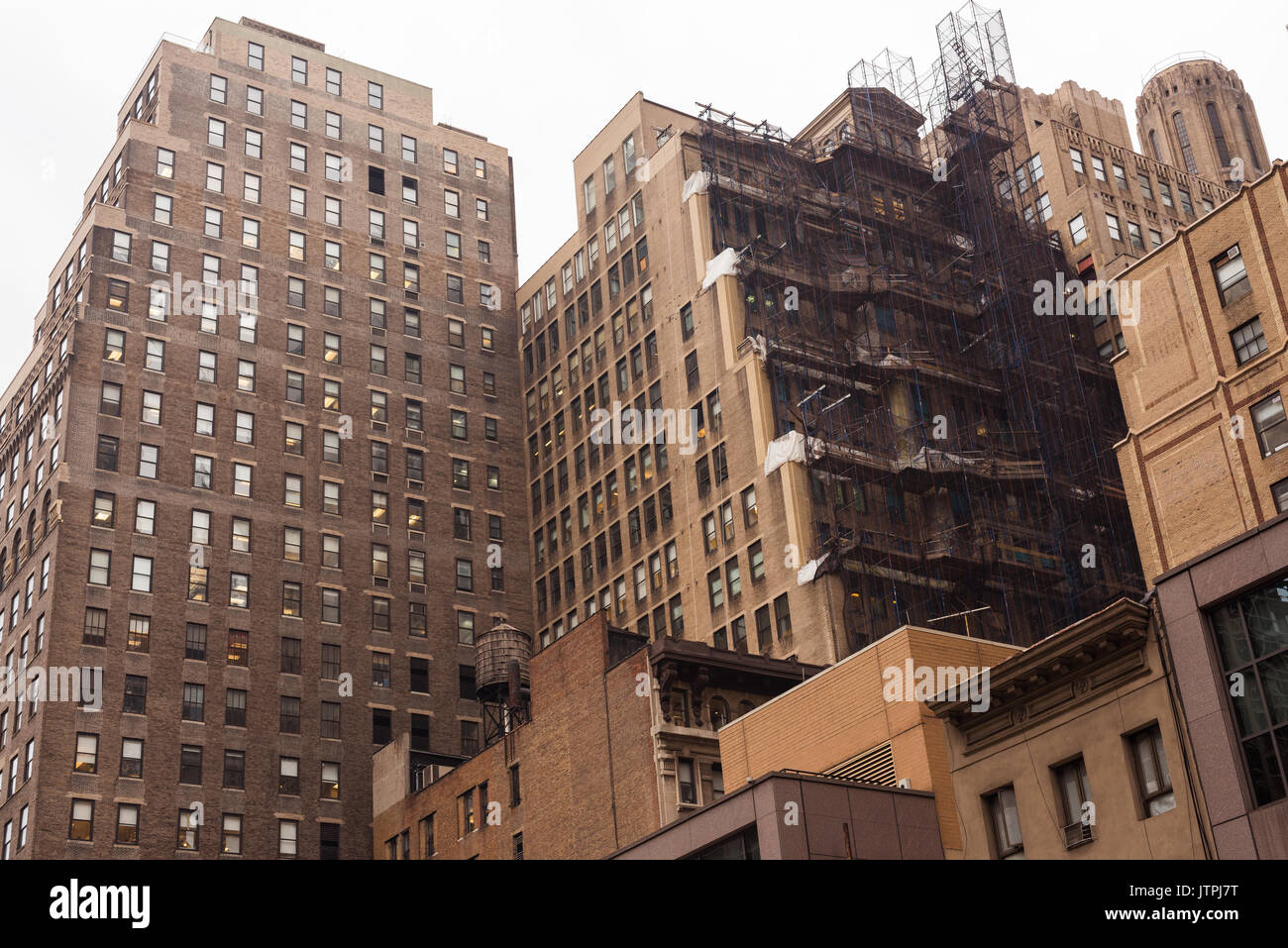 Scaffolding up on a building in Midtown where work is in progress. Stock Photo
