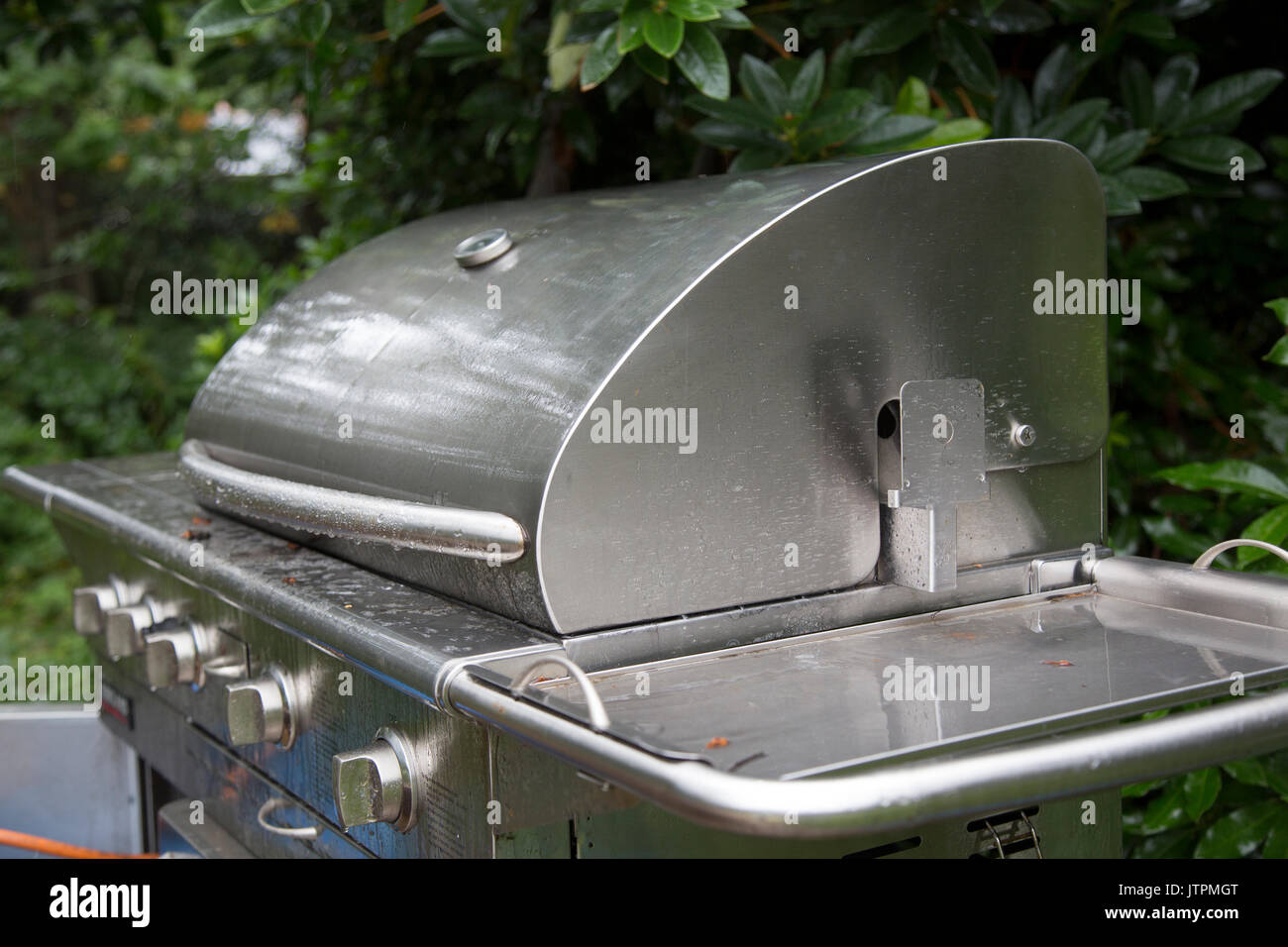 Rain Falling on a Stainless Steel Barbecue Stock Photo Alamy