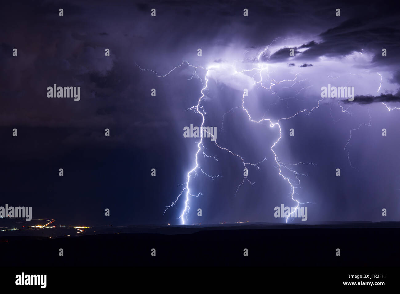 Twin lightning bolts strike in a thunderstorm Stock Photo - Alamy