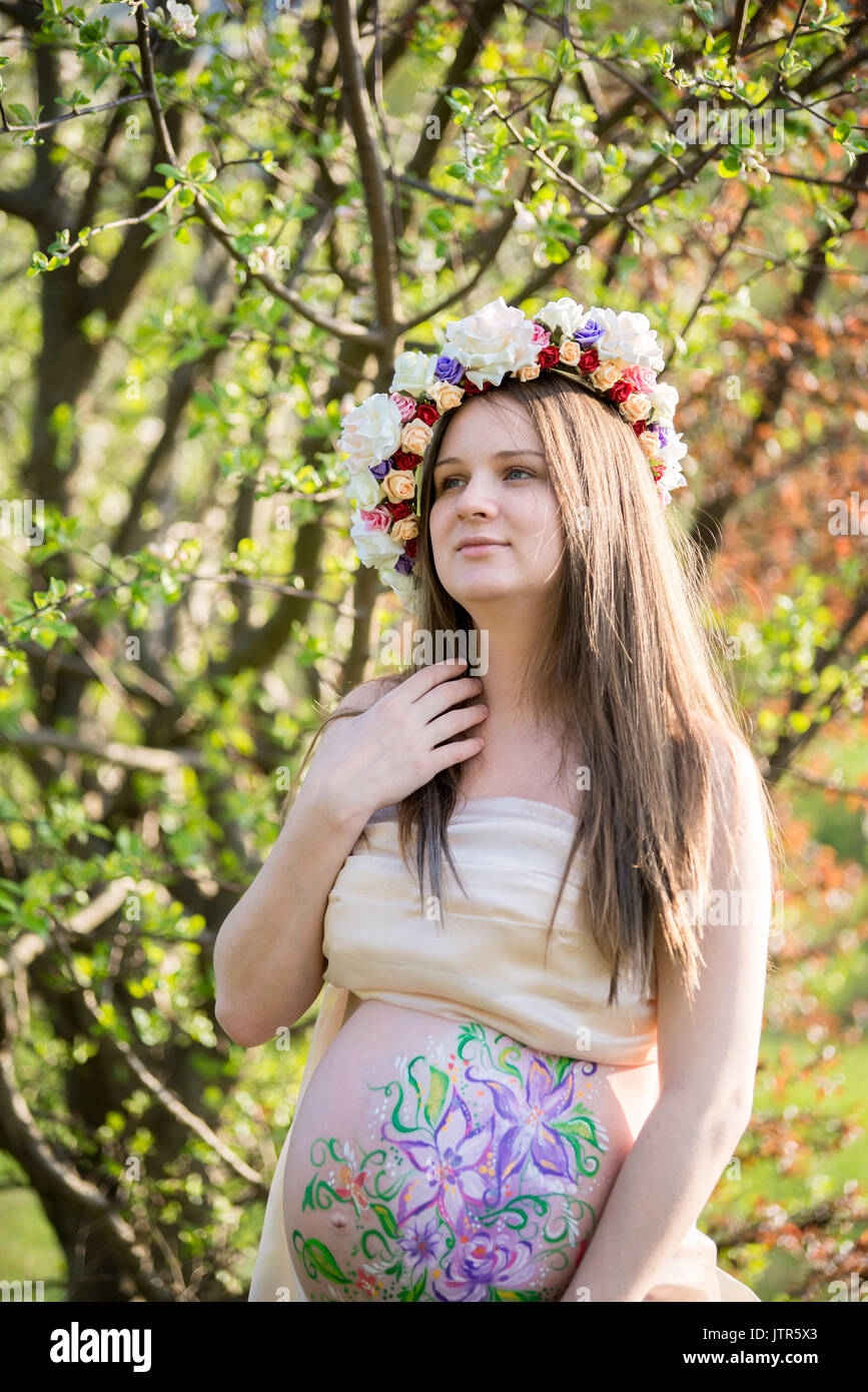 The pregnant girl on walk in city park Stock Photo - Alamy