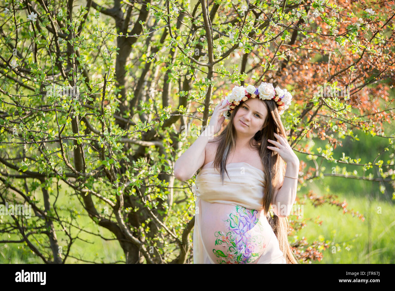 The pregnant girl on walk in city park Stock Photo - Alamy