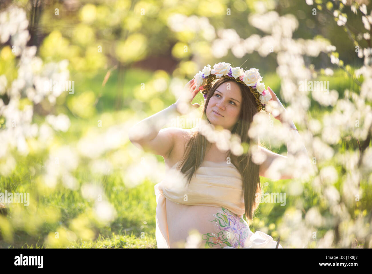 The pregnant girl on walk in city park Stock Photo - Alamy