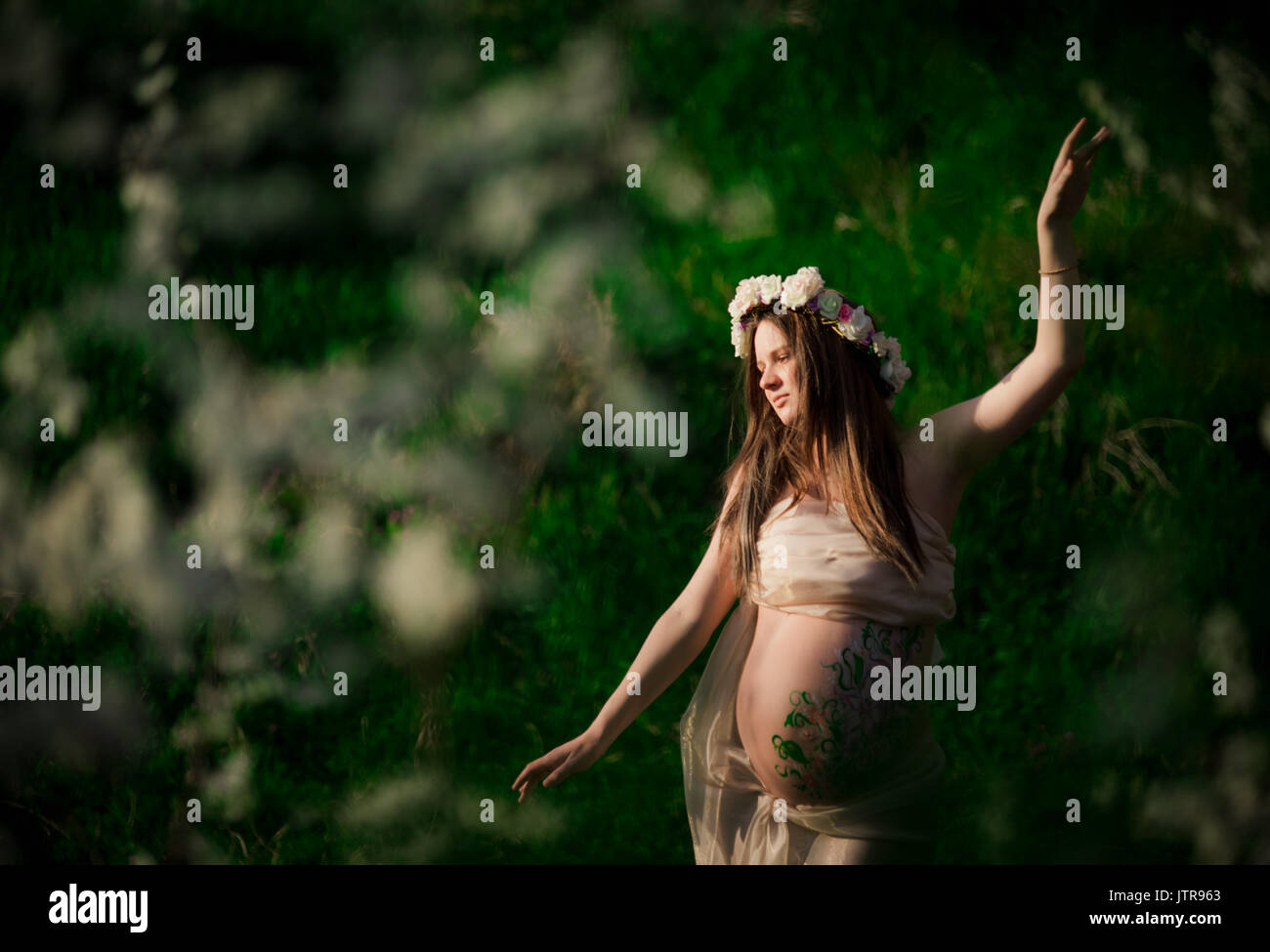 The pregnant girl on walk in city park Stock Photo - Alamy