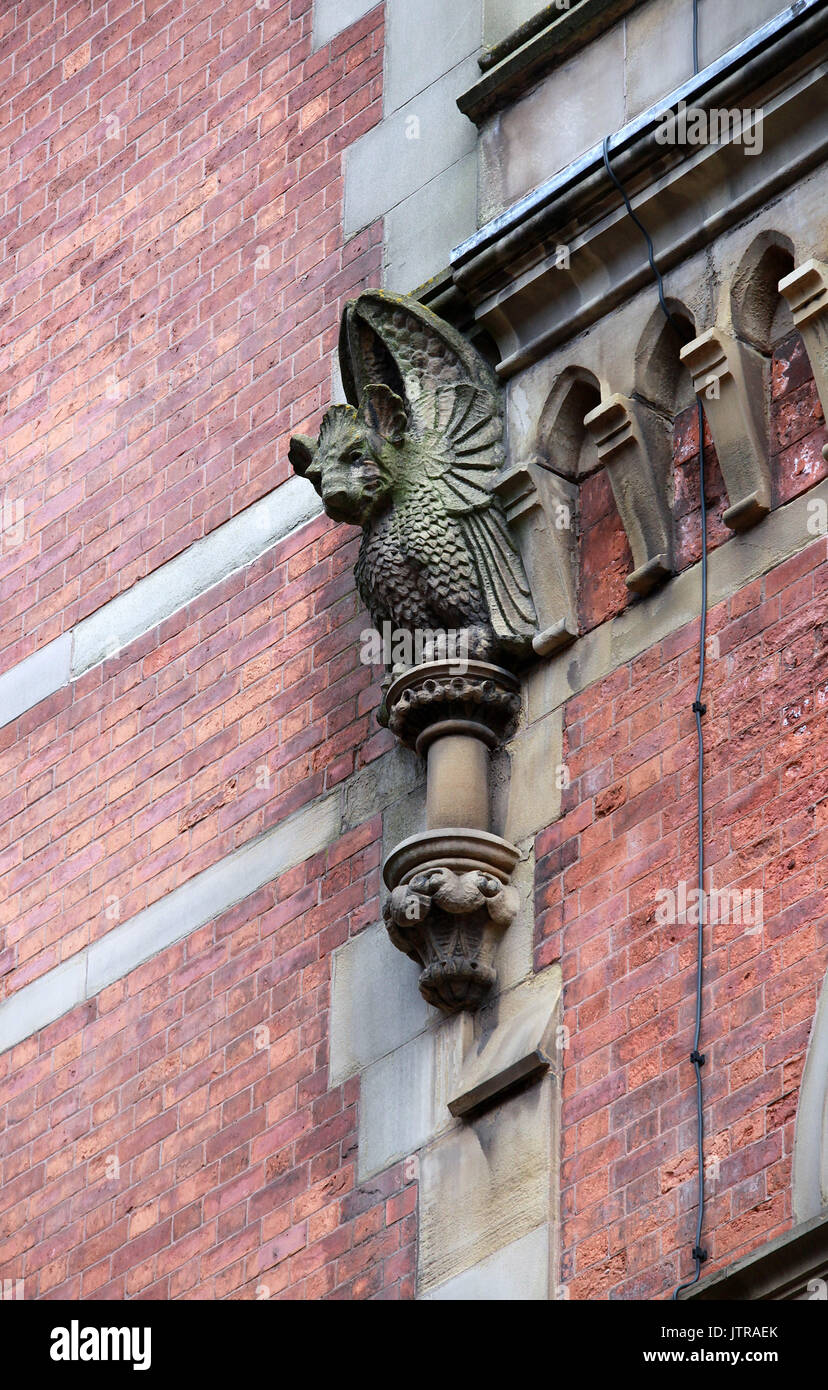 Carved stone grotesque on Minshull Street Crown Court building in Manchester Stock Photo
