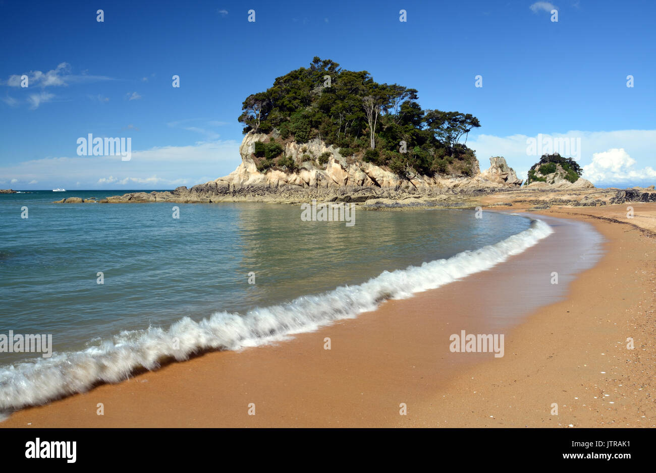 The golden sands & crystal clear water at Kaiteriteri beach, New Zealand with copy space. Stock Photo