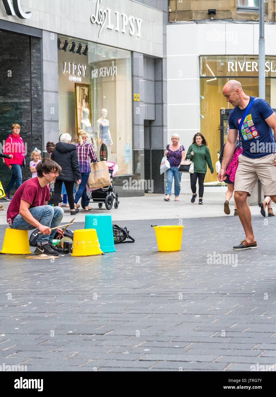 Male busking in the busy shopping streets of Liverpool using plastic ...