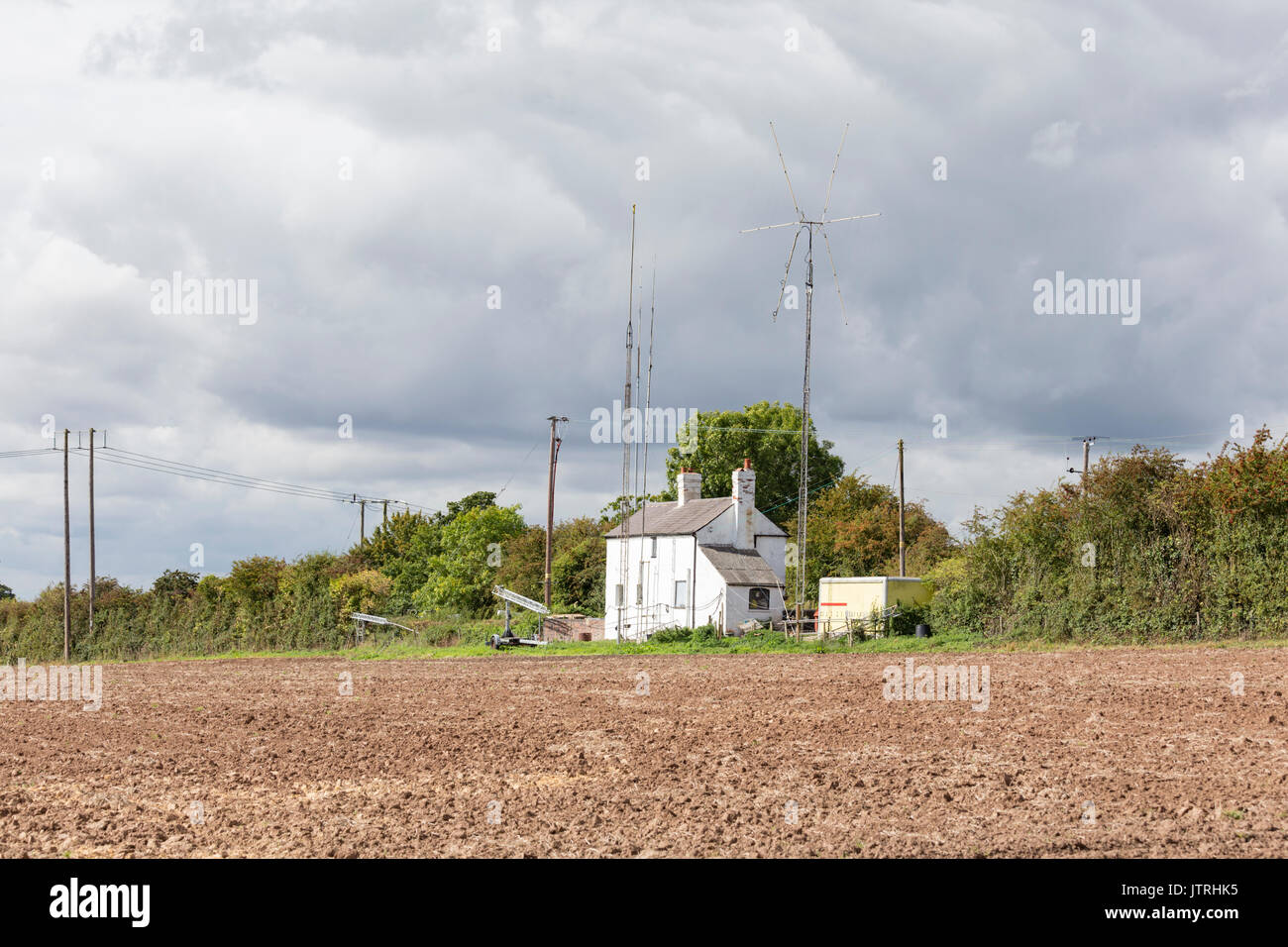 Amateur radio masts on a country cottage, England, UK Stock Photo