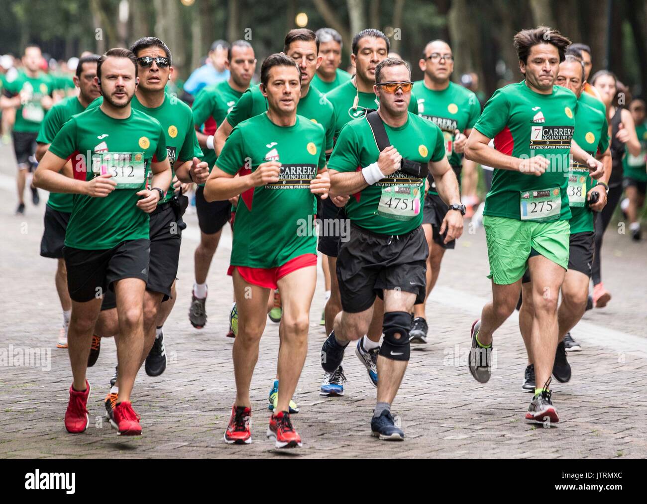 Mexican President Enrique Pena Nieto, center, takes part in the 7th Molino del Rey race in the forest of Chapultepec July 17, 2017 in Mexico City, Mexico.   (presidenciamx via Planetpix) Stock Photo