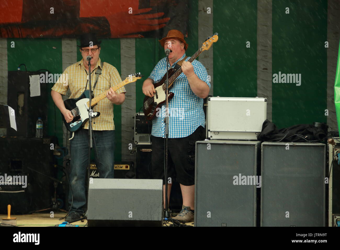 Five little pigs guitar and bass players,quayside music festival,weymouth,dorset,uk Stock Photo