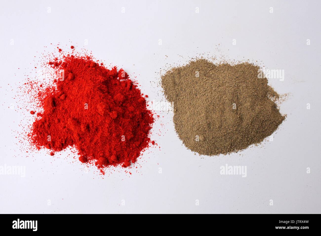 Cayenne pepper and ground black pepper Stock Photo Alamy