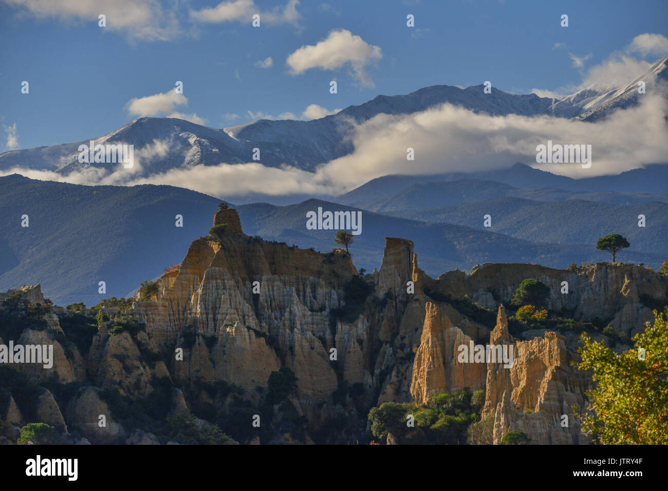 Les Orgues, with Mt Canigou in the background, Pyrenees Orientales, France. Stock Photo
