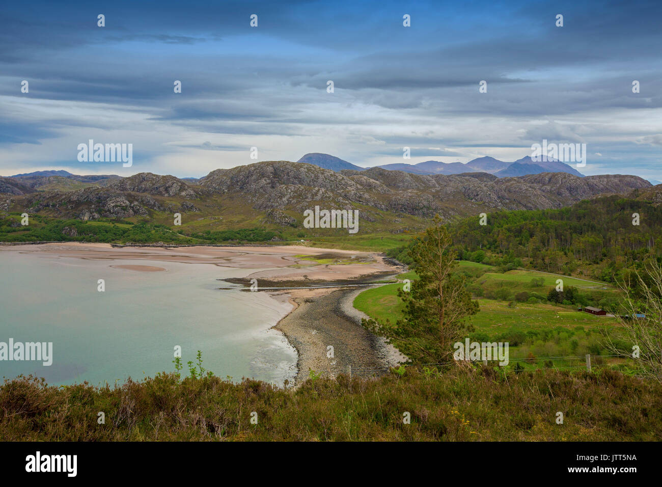Vast and stunning coastal andscape dominated by beach and mountains near Poolewe, Scotland Stock Photo